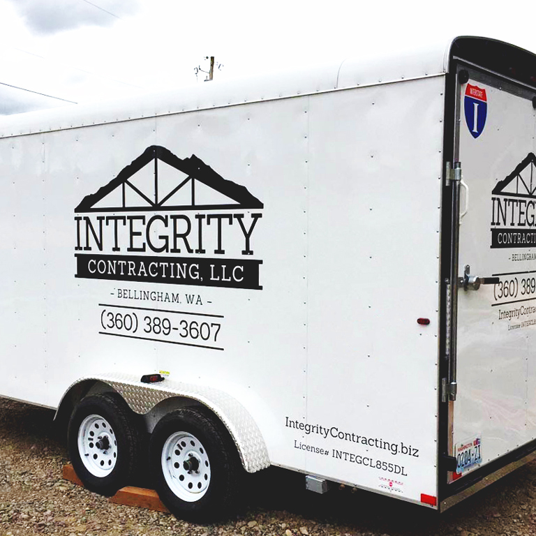 Integrity Contracting logo on utility trailer